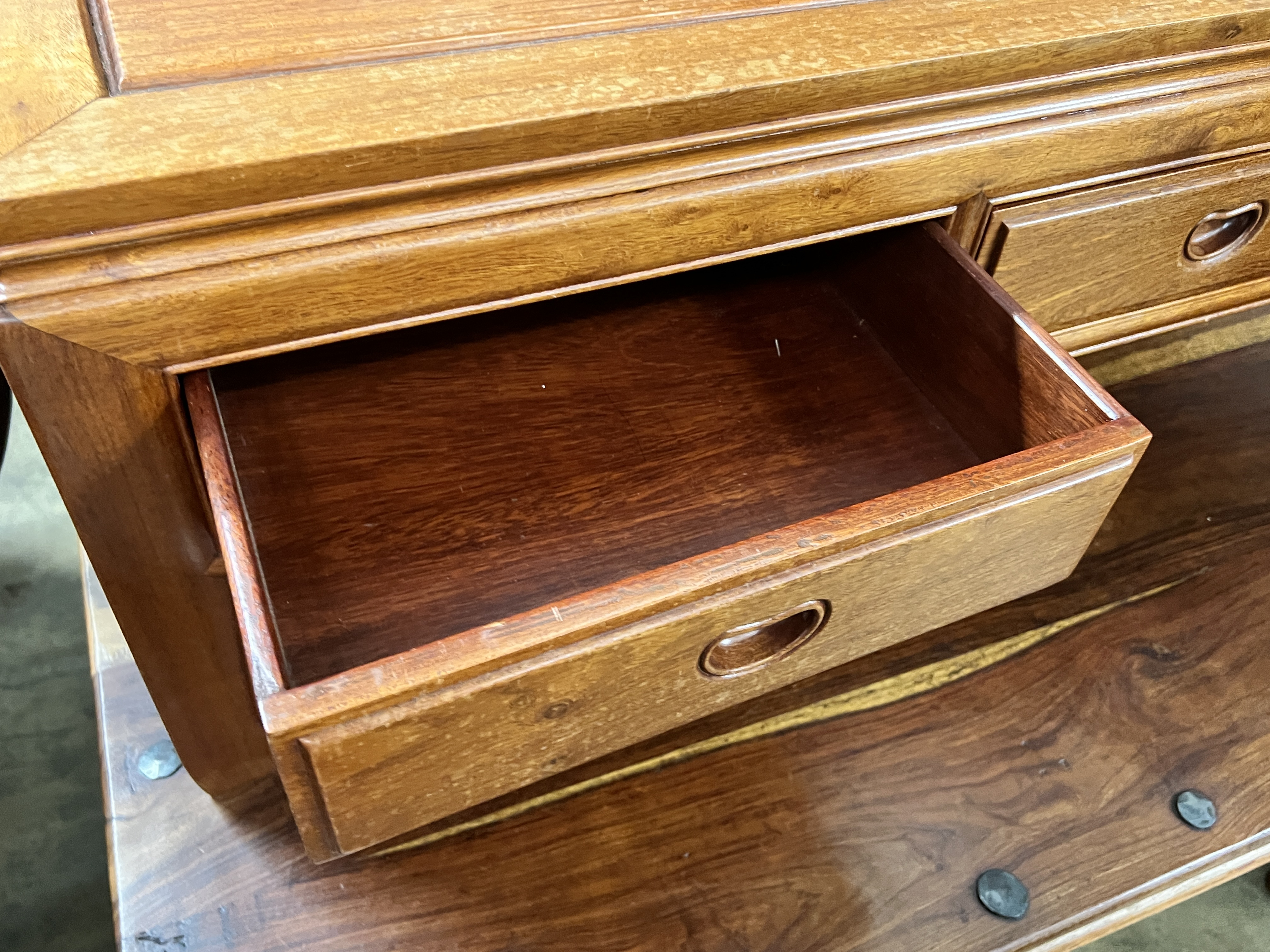 A Chinese rectangular hardwood three drawer coffee table, width 127cm, depth 50cm, height 40cm